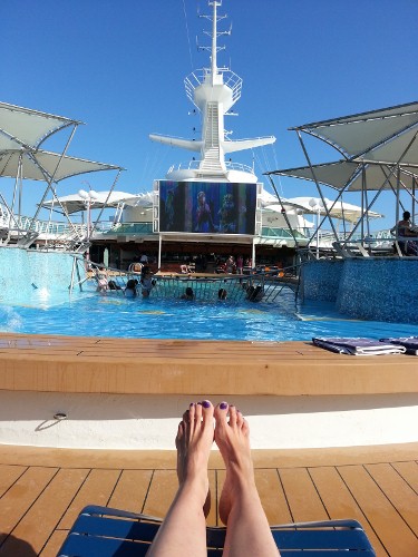 This is where I'd like to be today as I celebrate my birthday - on a cruise, sitting next to my husband, watching the kids swim while enjoying a movie and a drink.  Instead I'll be at home, taking kids to school, saying goodbye to my husband as he goes off to a long day at the restaurant.  Just another day . . . except now I'm officially old.